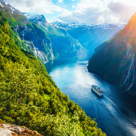 Breathtaking view of Sunnylvsfjorden fjord and famous Seven Sisters waterfalls, near Geiranger village in western Norway.